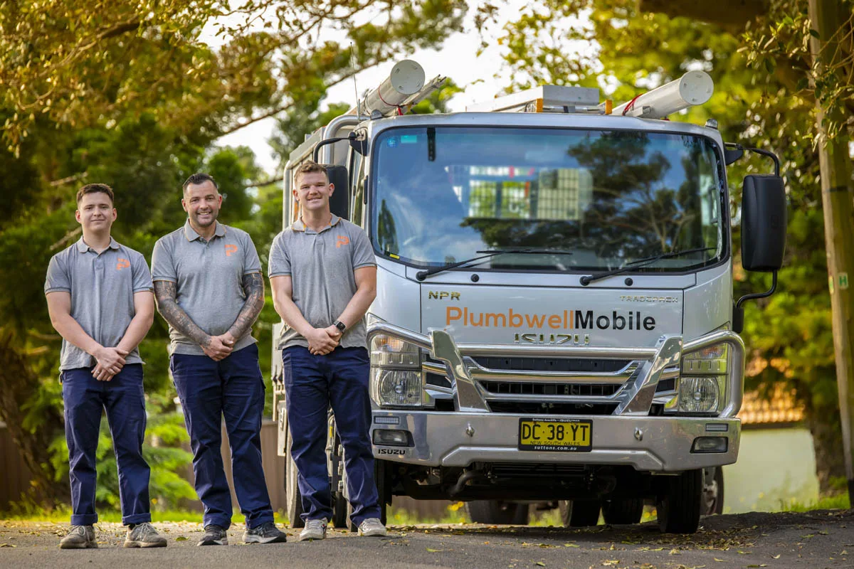 Three of the team beside the fully stocked truck